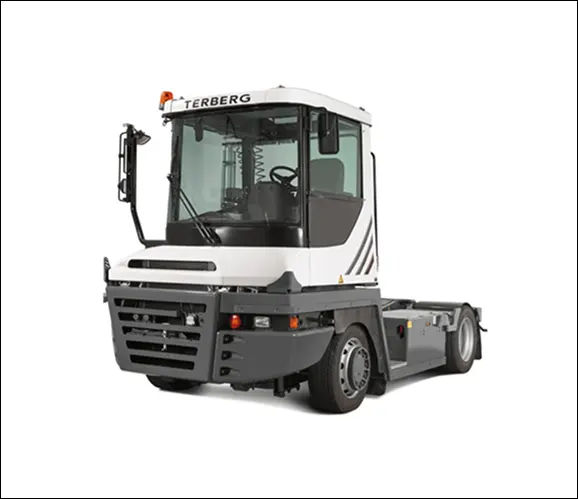 Modern industrial terminal tractor in white and black colors.